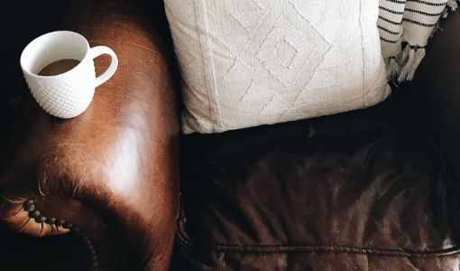 Leather Chair with coffee on arm