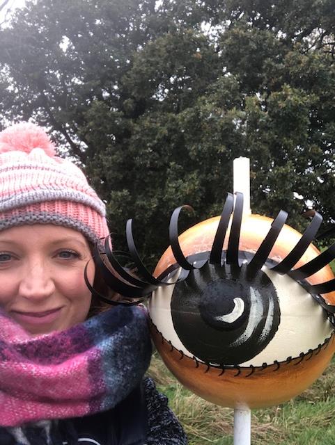 Dr Lisa with an eye ball art structure