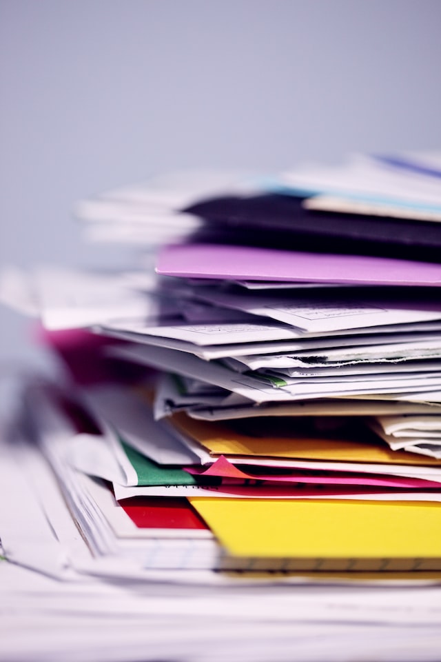 Pile of messy files- image by Alexander Grey (Unsplash)